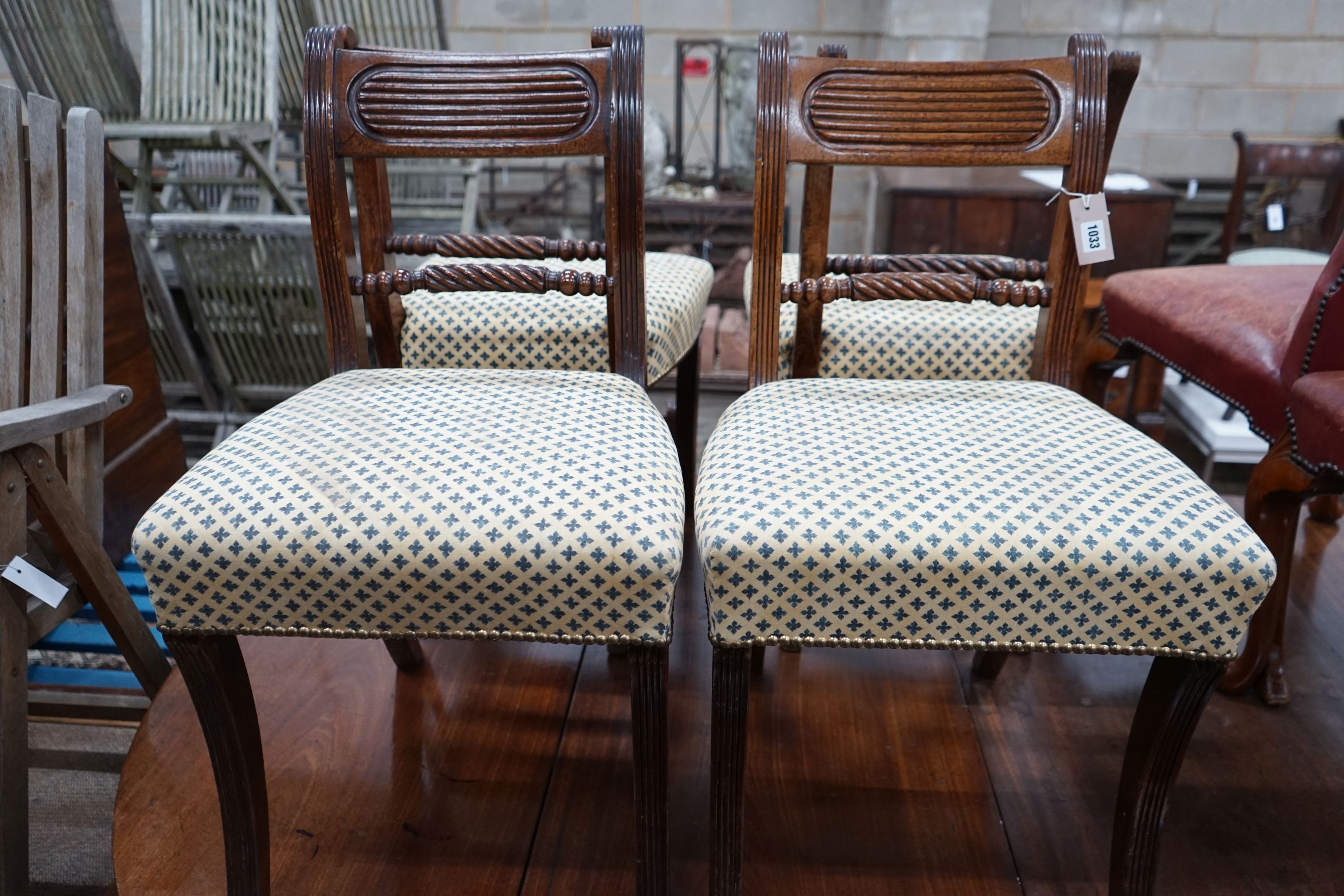 A set of six Regency sabre leg mahogany dining chairs
